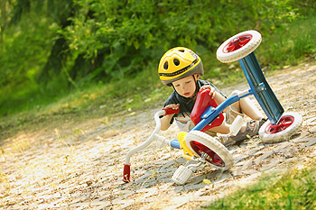 Child falling off tricycle